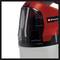 Red and black Einhell spray cleaner with white tank.