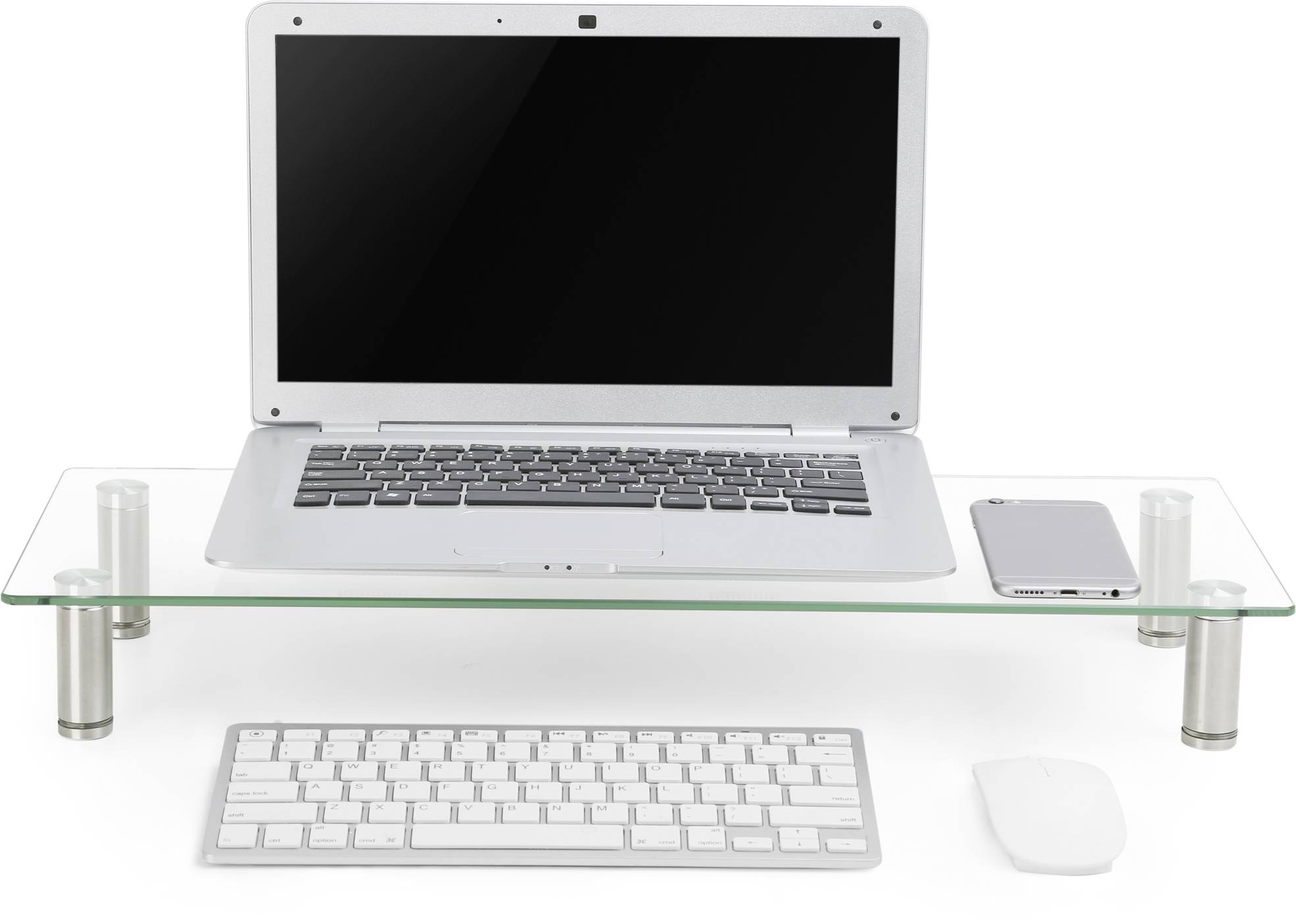 'Laptop on glass stand, with keyboard and mouse underneath. A smartphone lies next to the laptop. Workspace in minimalist design.'