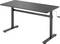 Black height-adjustable desk with crank mechanism, rectangular tabletop, two table legs. Ideal for flexible working while standing or sitting.