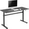 Height-adjustable desk with computer, keyboard and mouse on the desktop. Ideal for ergonomic working in the office.