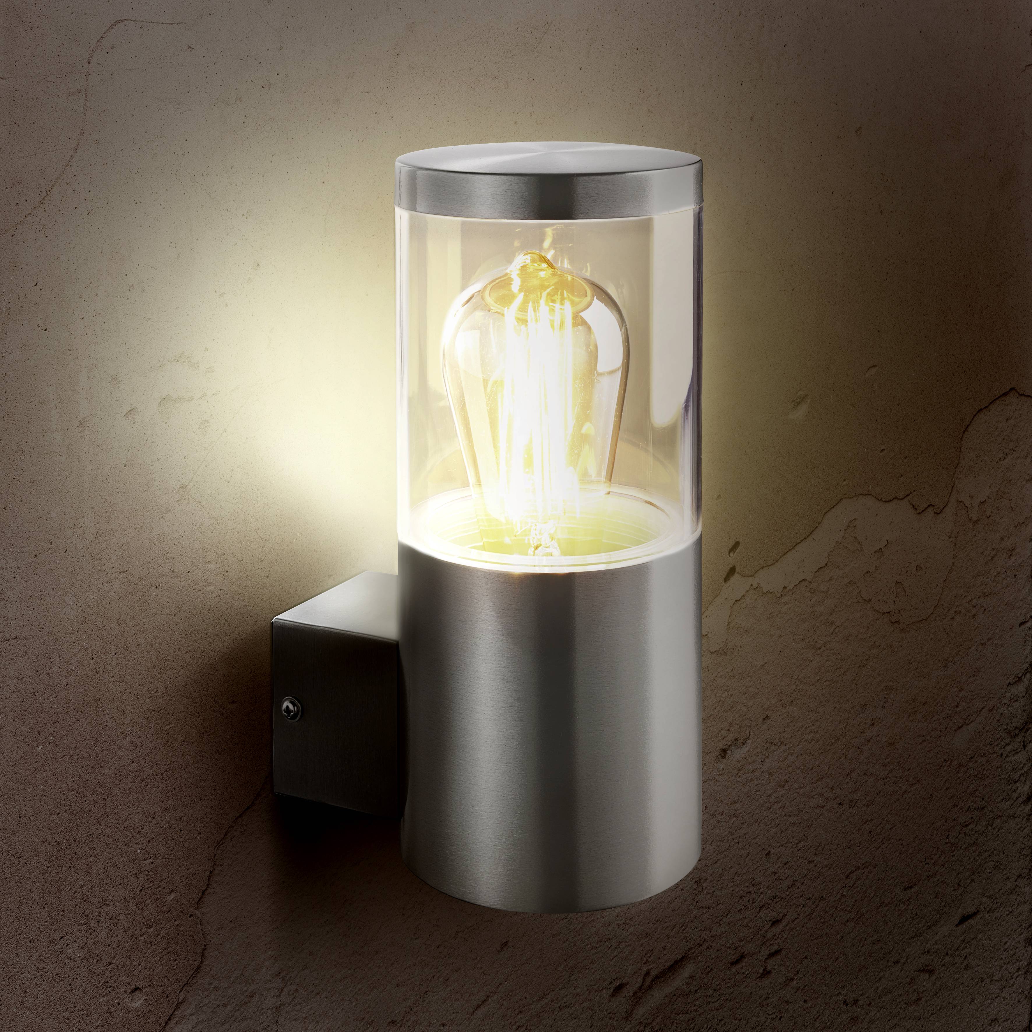 A contemporary wall light with a visible light bulb, providing warm illumination, mounted on a textured stone wall.