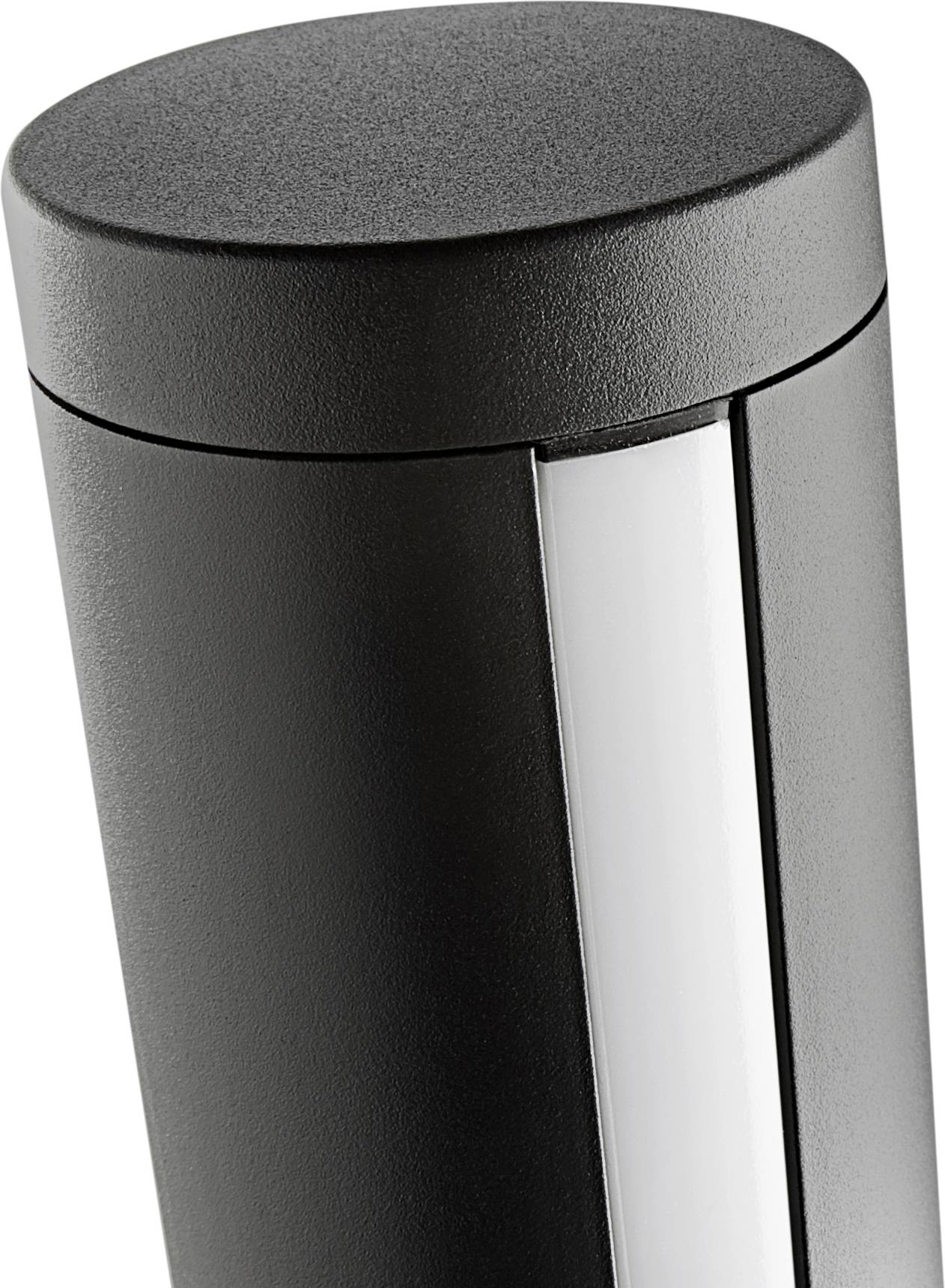'Close-up of a modern black column with a vertical white light strip. Stylish design for urban lighting.'