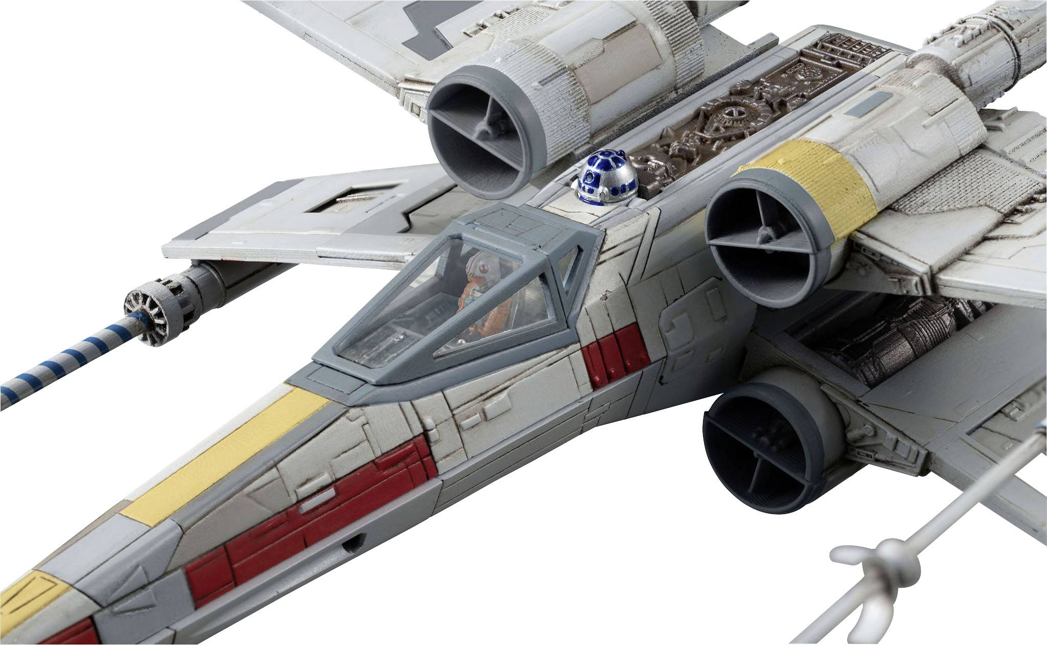 A model of a spaceship with wings and engines, with a small robot sitting on top. It is reminiscent of sci-fi films.