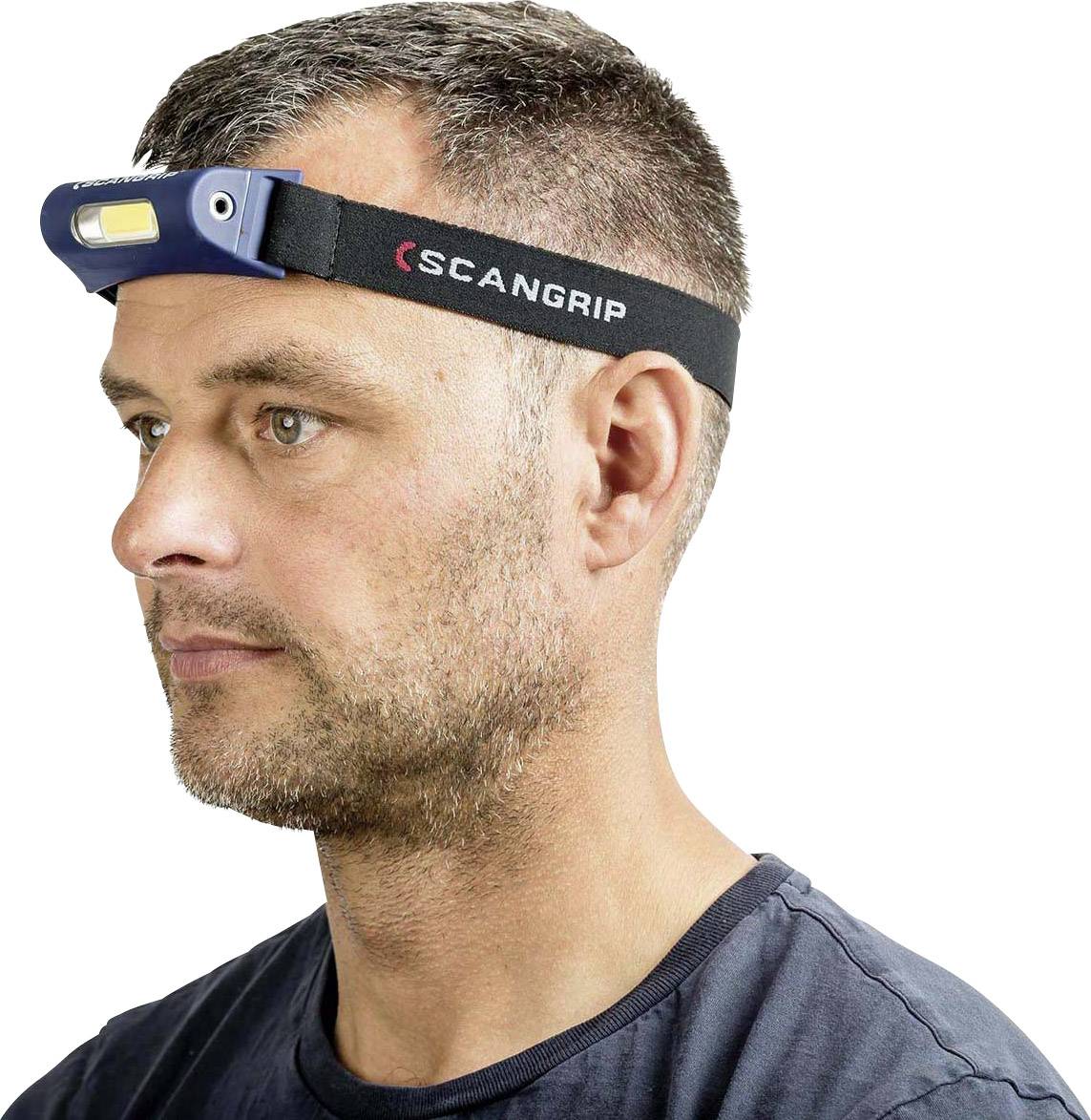 A man is wearing a headband with an integrated LED light, suitable for working in dark environments.