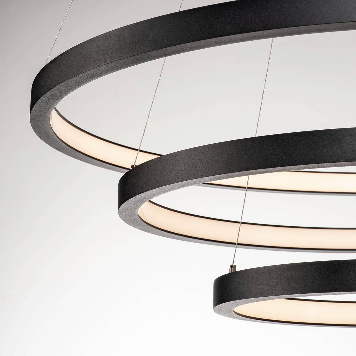 Modern circular LED ceiling light with three black and grey rings arranged at different heights.