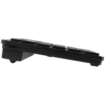 Side view of a flat, black computer keyboard with a downward tilt. Shows the low height and slim profile.