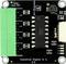 Industrial digital input module with label 'Input max 36V', six green connectors and central chip.