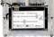 A display shows the options 'Settings: Display' with sliders for 'Bright' and 'Contr'. Electronic components are located above.