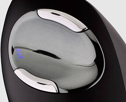 Close-up of a modern, black steam iron with a metallic sheen and blue lights on the front.