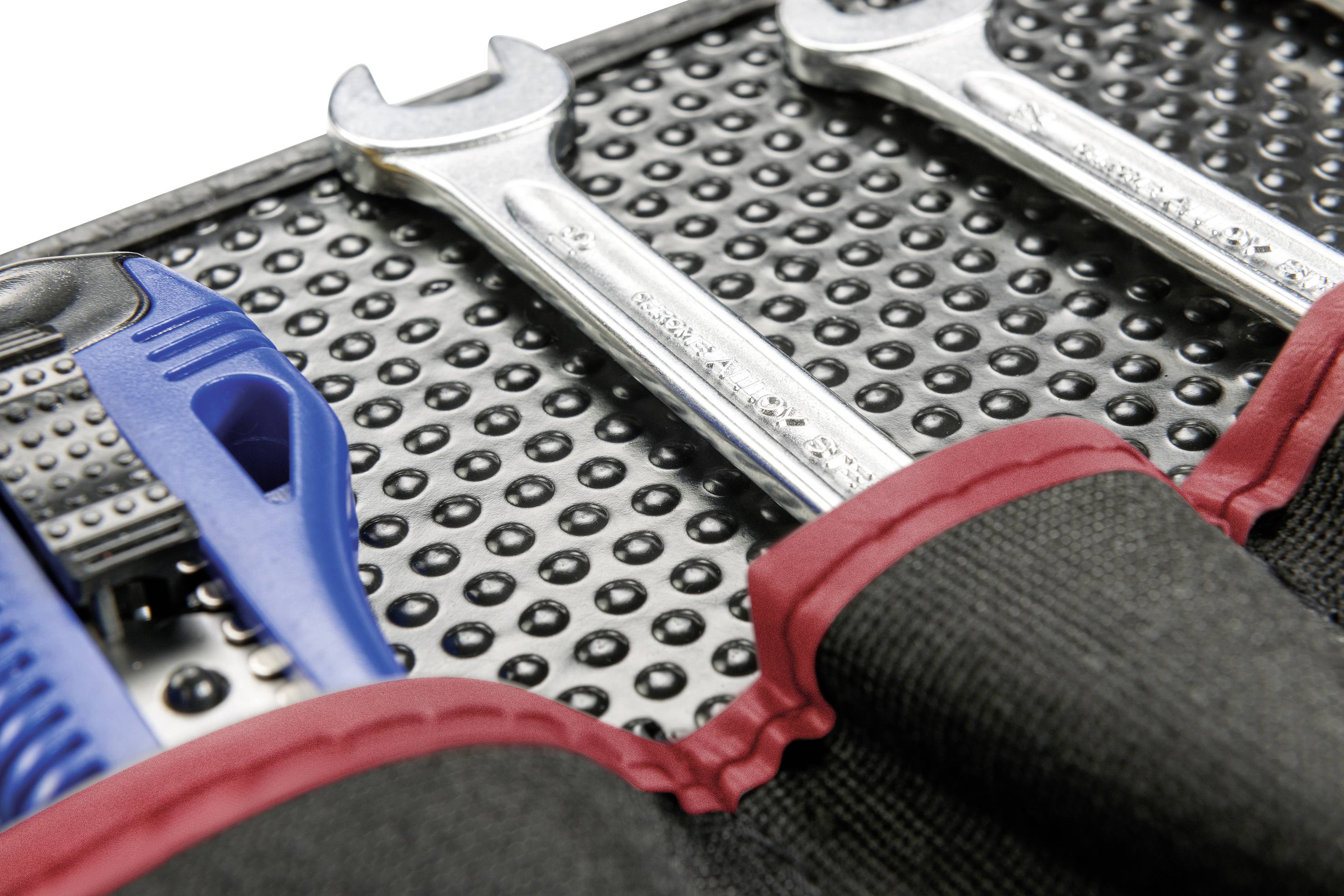Tool set with two spanners and a pair of pliers in a black organiser with a red border.