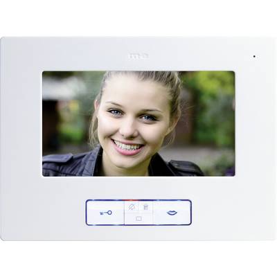 A woman is smiling at the camera. The image is displayed on the screen of a video entry phone system.