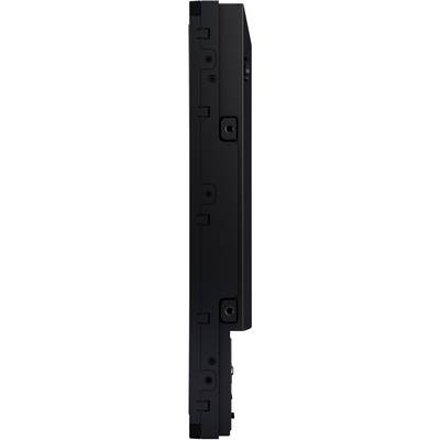 A laptop, viewed from the side, reveals its sleek construction and ports on the side. Simple, black design.
