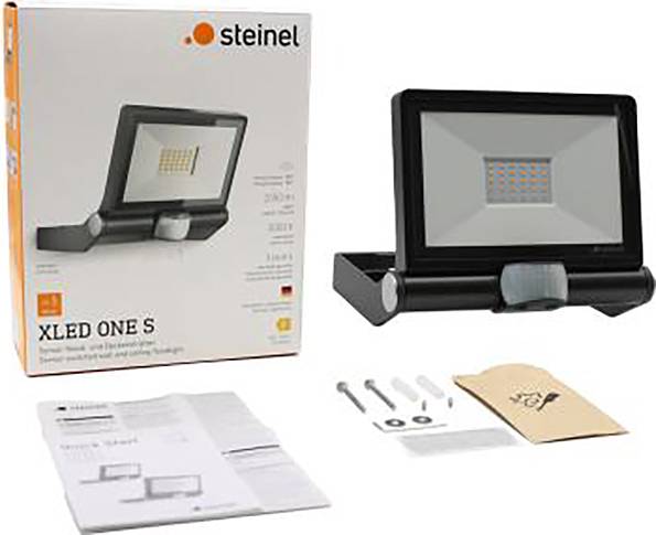 'Steinel XLED ONE S' outdoor floodlight set comprising product packaging, an LED floodlight, mounting accessories, and operating instructions.