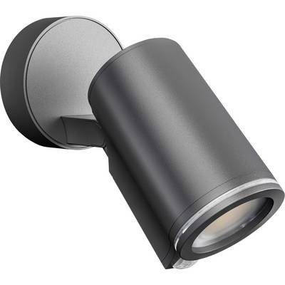 Black outdoor wall light with cylindrical housing mounted on a wall bracket, casting light downwards. Modern design for directional illumination.