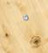 Metal screw in a wooden board, demonstrates a robust fixing solution. Surface shows natural wood grain and knot.