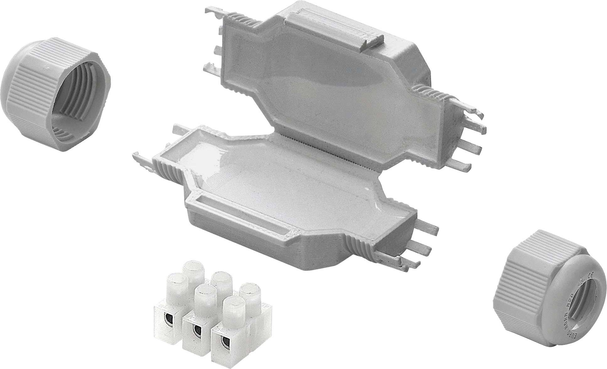 A grey cable connector, consisting of two halves, pictured with a terminal block and two screw caps.