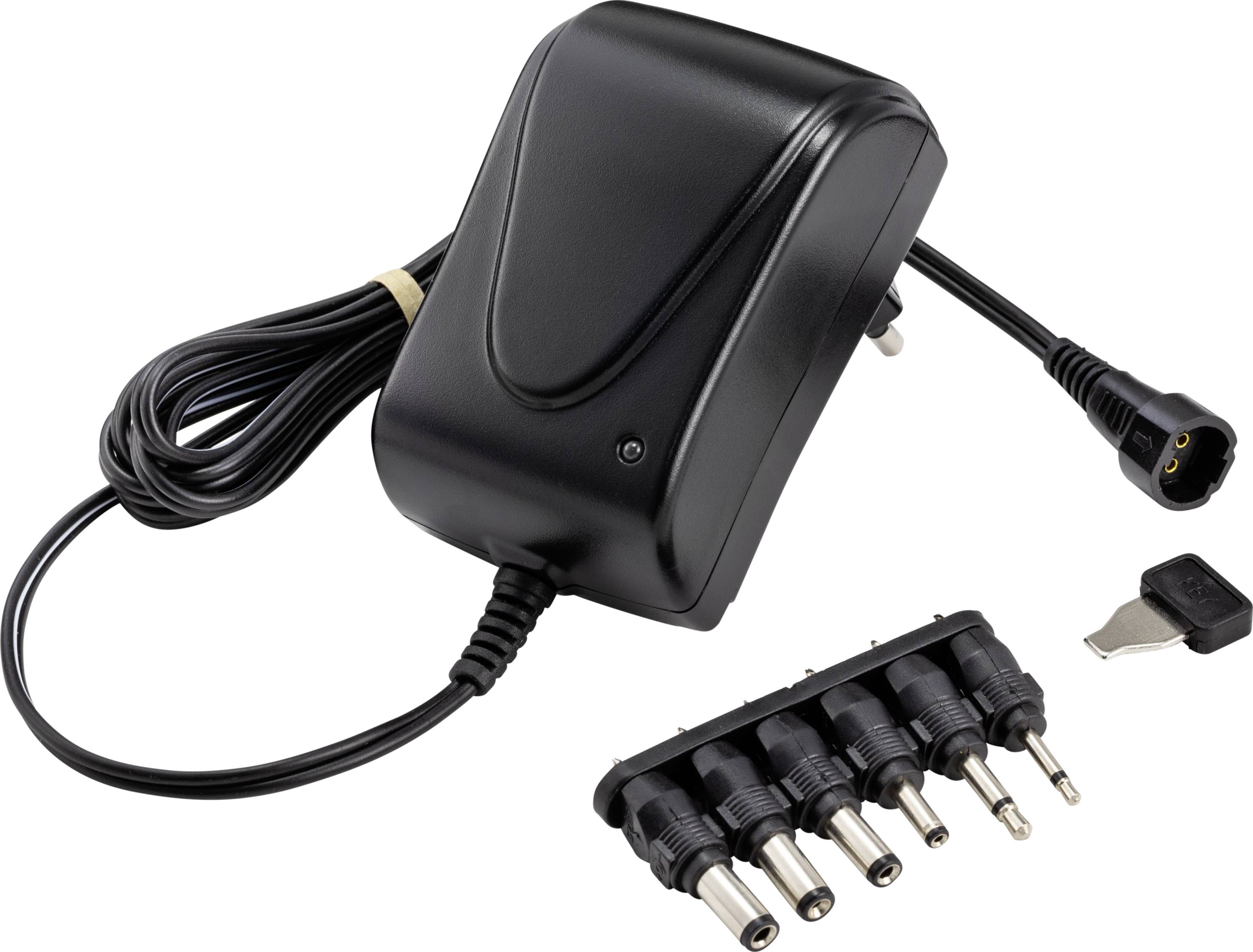 A black power supply with multiple interchangeable plugs for different devices, next to a small tool.