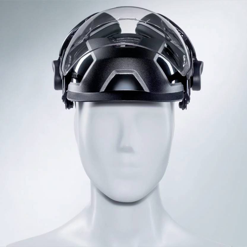 A transparent protective helmet on a white model head, showing the ventilation system and side protective functions.
