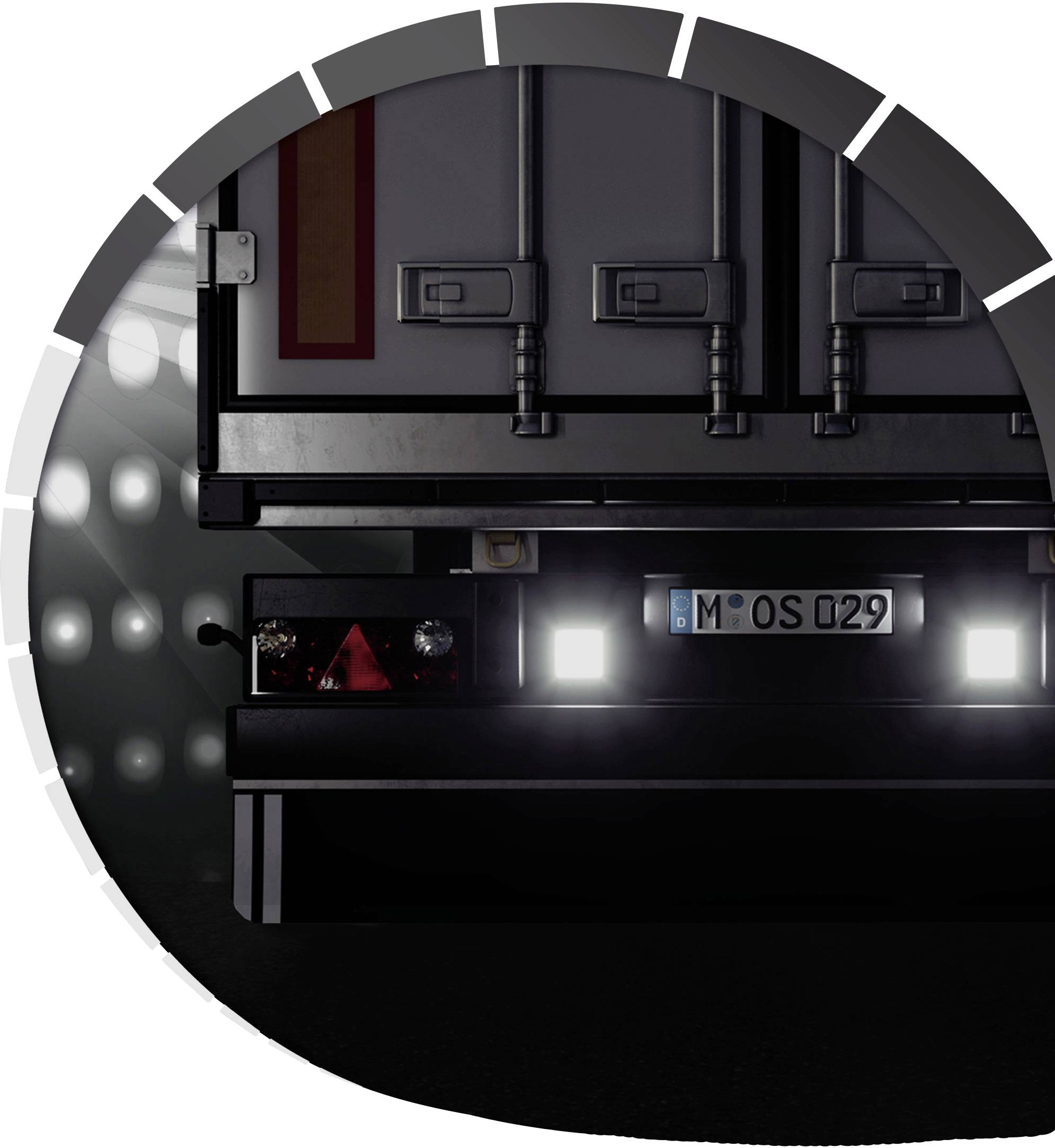 Close-up of a lorry reversing into an illuminated loading bay. Number plate and rear lights are visible.