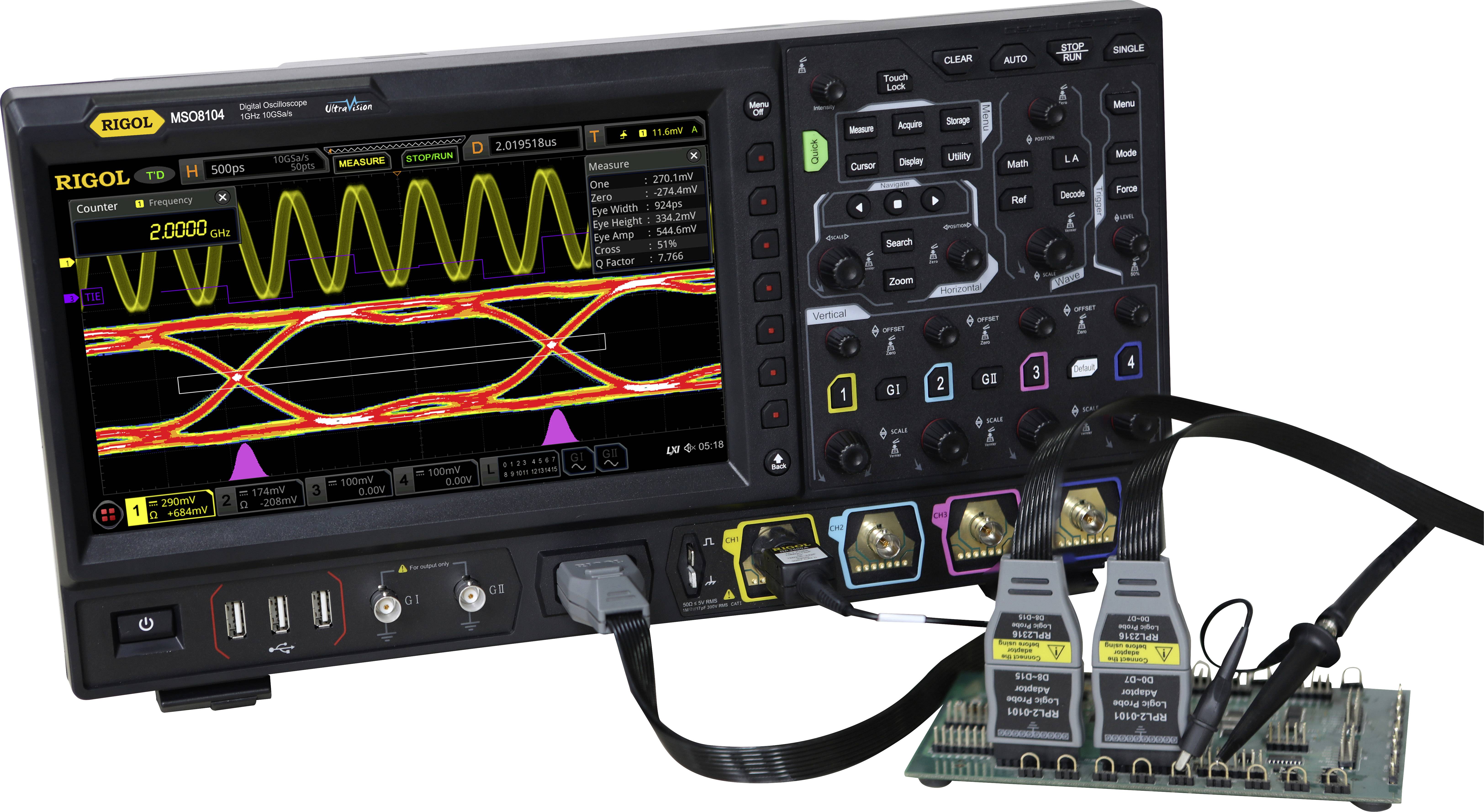Digital oscilloscope with dual-channel display of waveforms and diagrams, connected test circuit board with measurement cables.