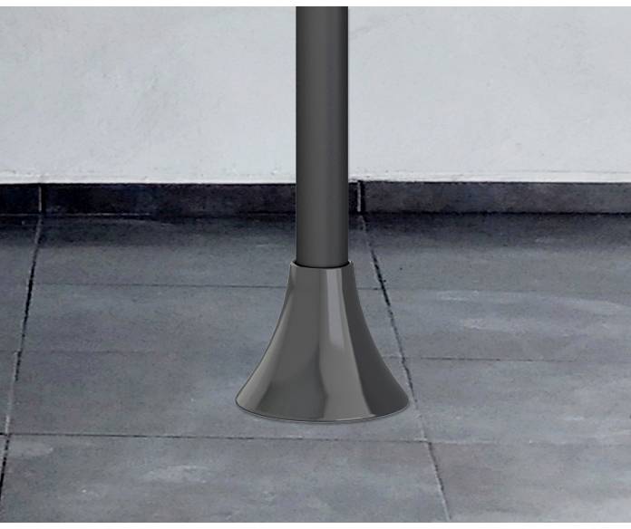 Foot of a black post on grey floor tiles.
