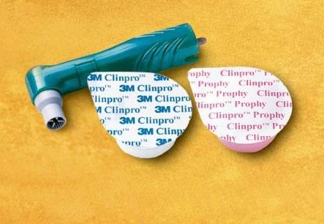 'Polishing cup with 3M Clinpro Prophy Paste, orange background. 3M Clinpro Prophy Paste in two variants, for dental care.'