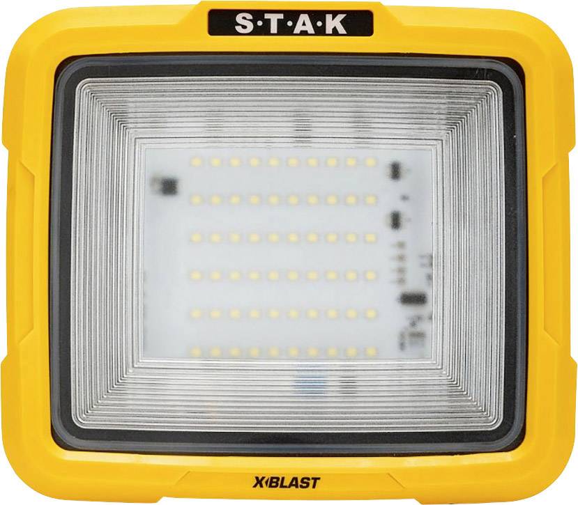 A rectangular, yellow LED work light with the inscription 'S.T.A.K' at the top and 'X-BLAST' at the bottom of the frame.