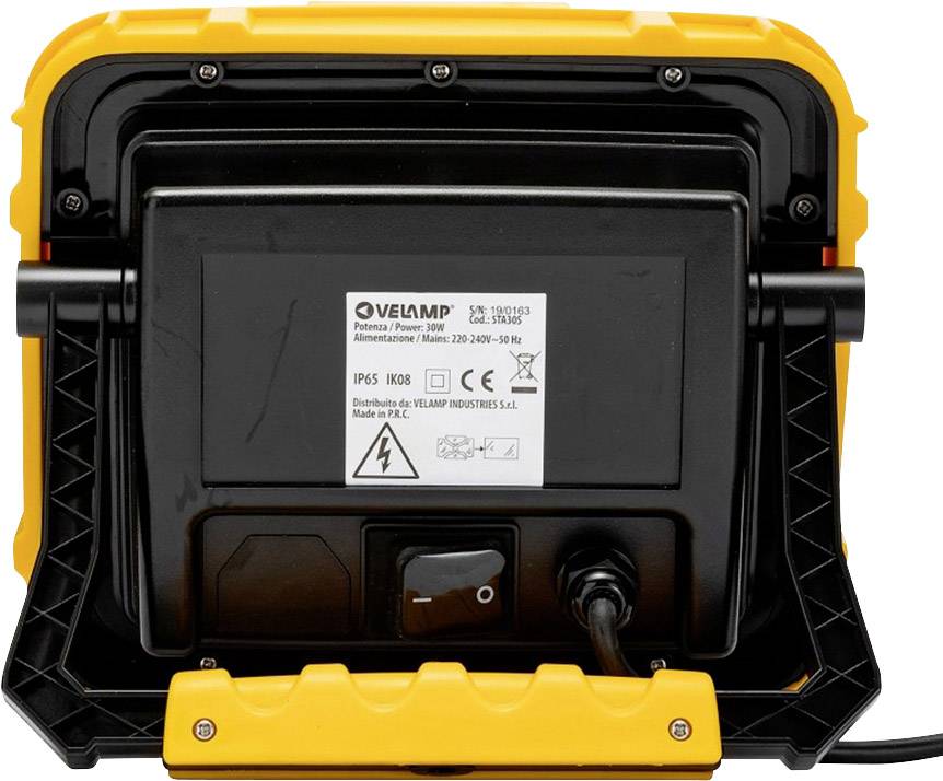 A yellow, portable work light in a robust housing with an electrical connection cable, rear view.