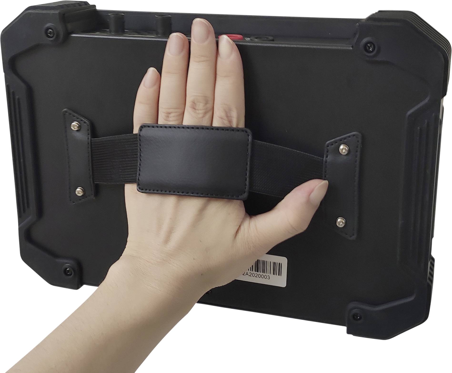 A hand is holding a robust, black tablet with a strap on the back. A barcode label is visible.