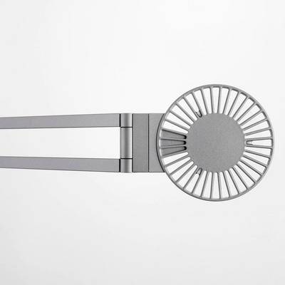 A silver, contemporary wall shelf with a round, grid-like design on the right side and flat arms on the left.