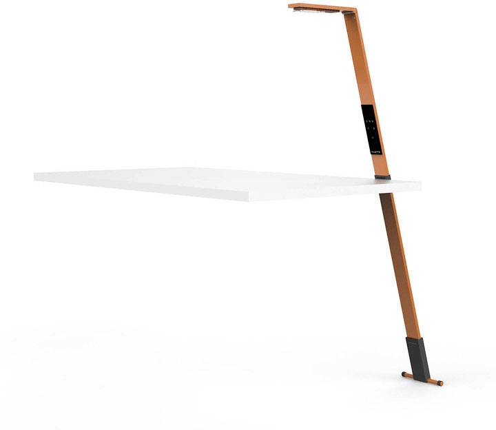 A modern table with an integrated, slim, orange lamp on an elegant, minimalist white table.