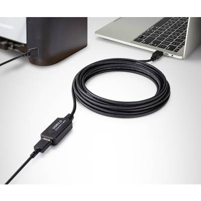 A long USB cable connects a computer with another device. The focus is on the cable length and the connection.