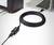 A long USB cable connects a computer with another device. The focus is on the cable length and the connection.