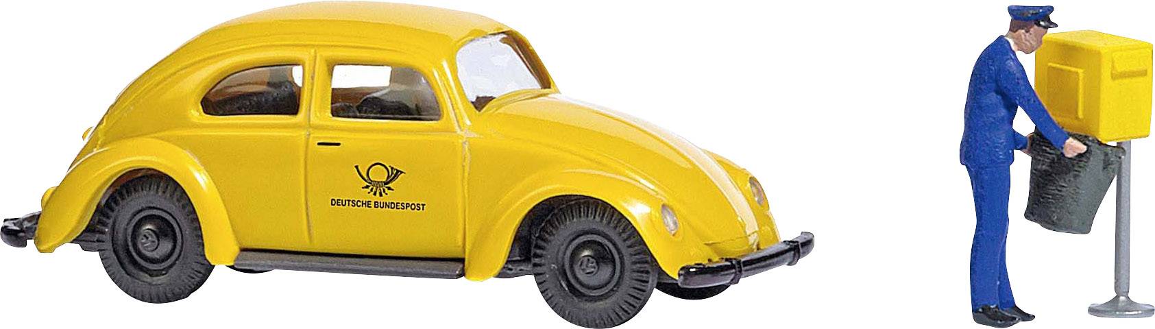 A yellow model car with a 'Deutsche Bundespost' logo sits beside a miniature figure in uniform, leaning against a postbox.