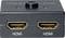 'HDMI Bi-Directional Switch' with two HDMI ports and a central button to select between two HDMI devices.