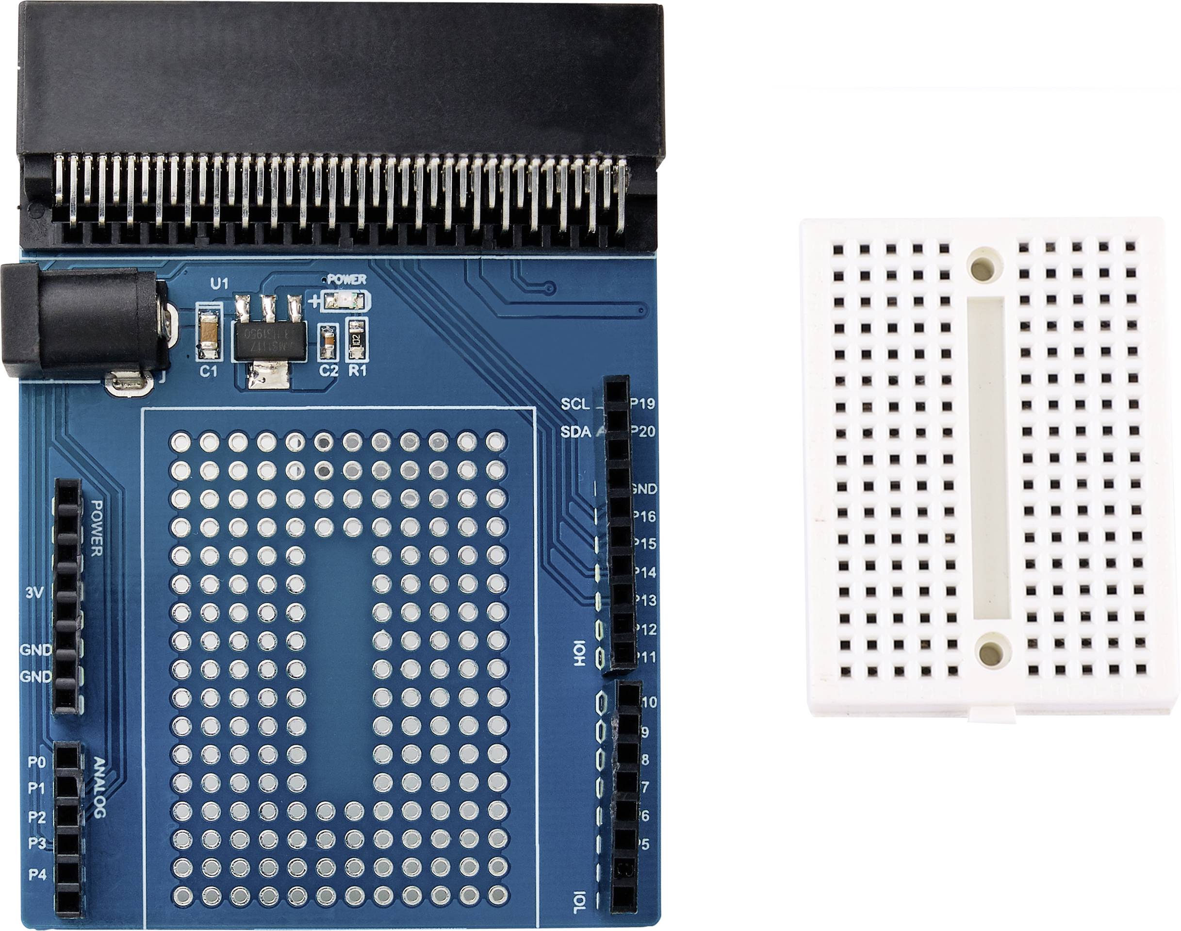 An electronic circuit with an expansion board on the left and a breadboard on the right for prototype development.