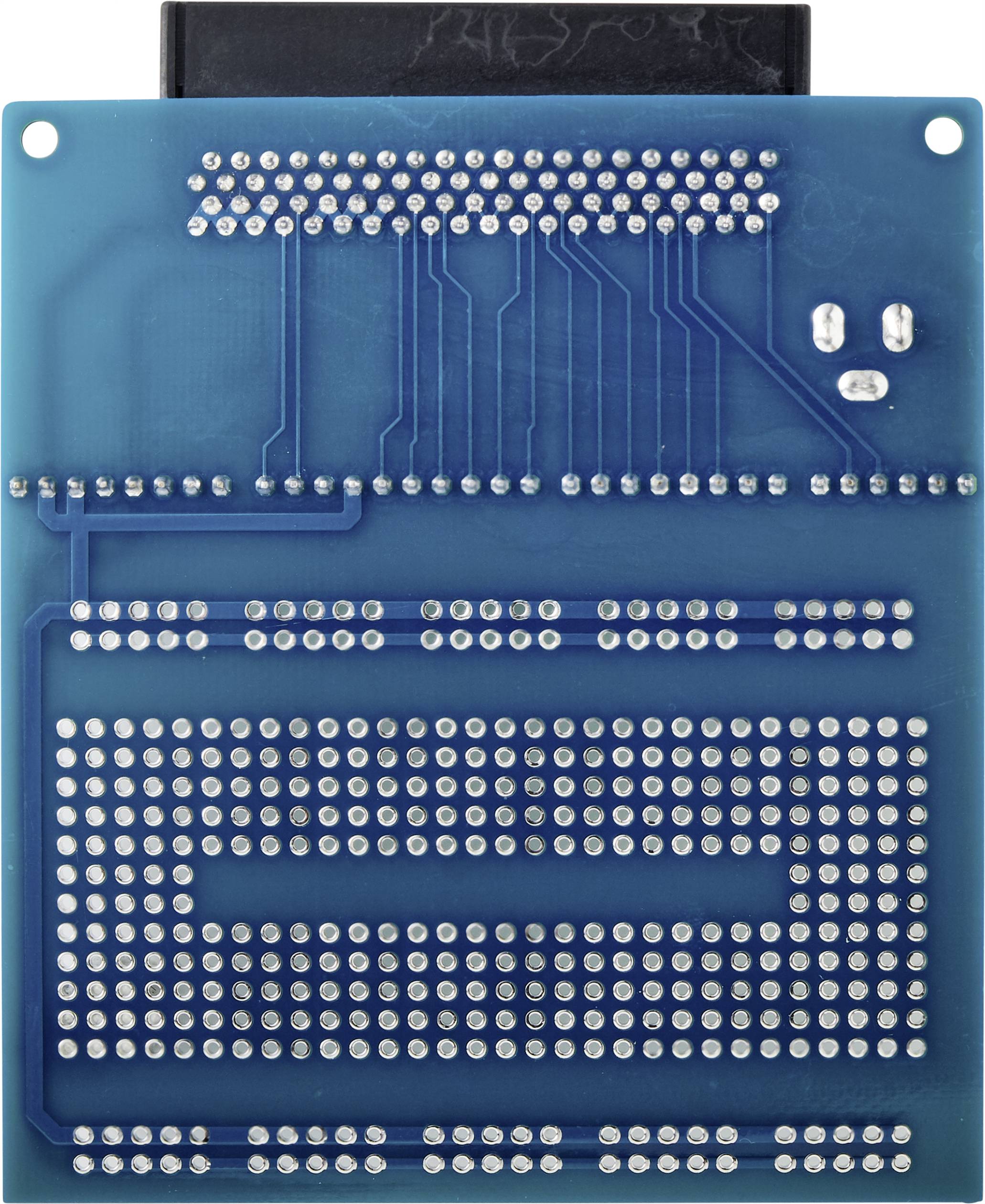 A blue electronic circuit board with numerous silver connection points and circuit traces depicting a complex circuit.