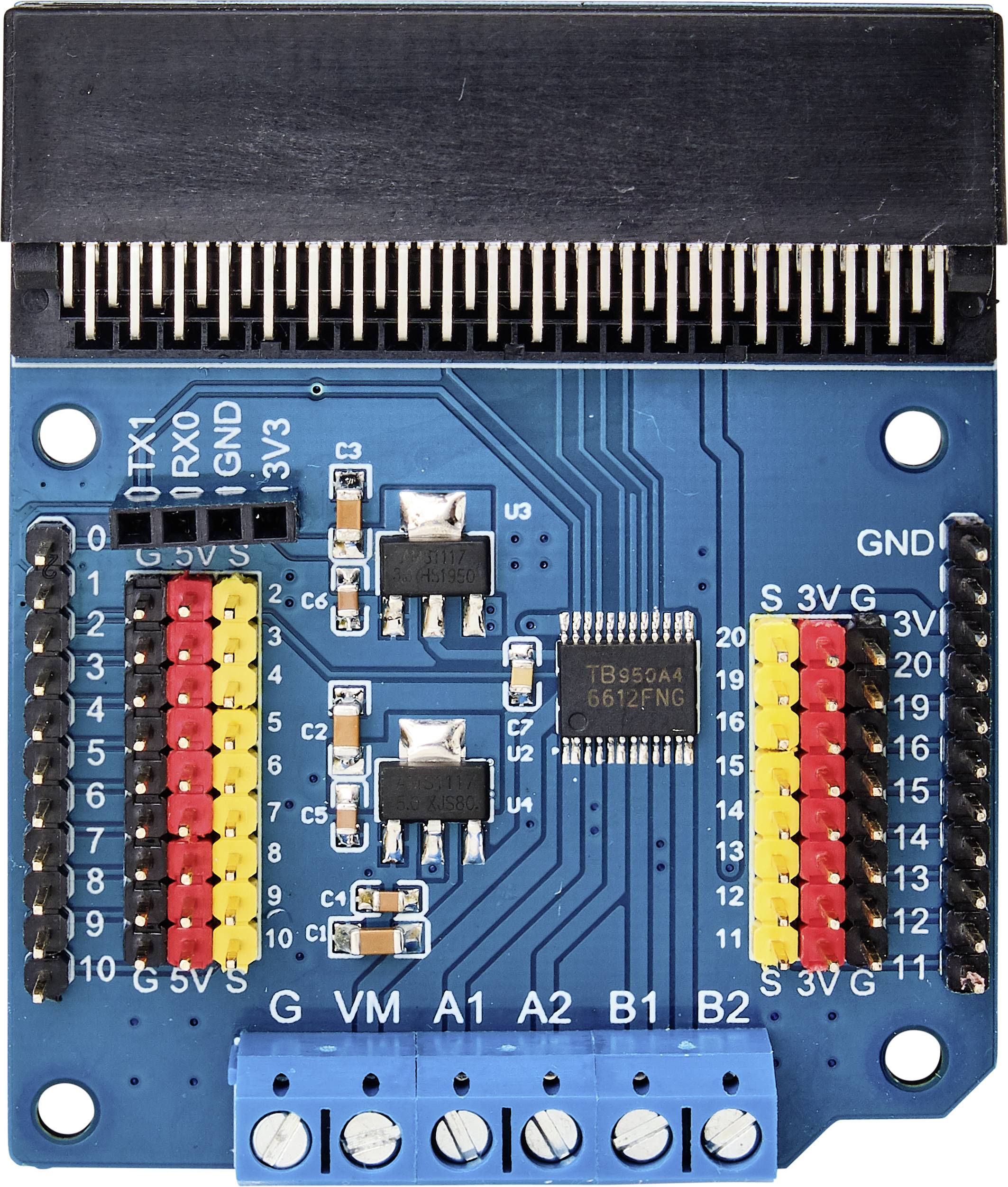 Top-down view of a blue circuit board with multiple colourful pins, sockets, and a central microchip.