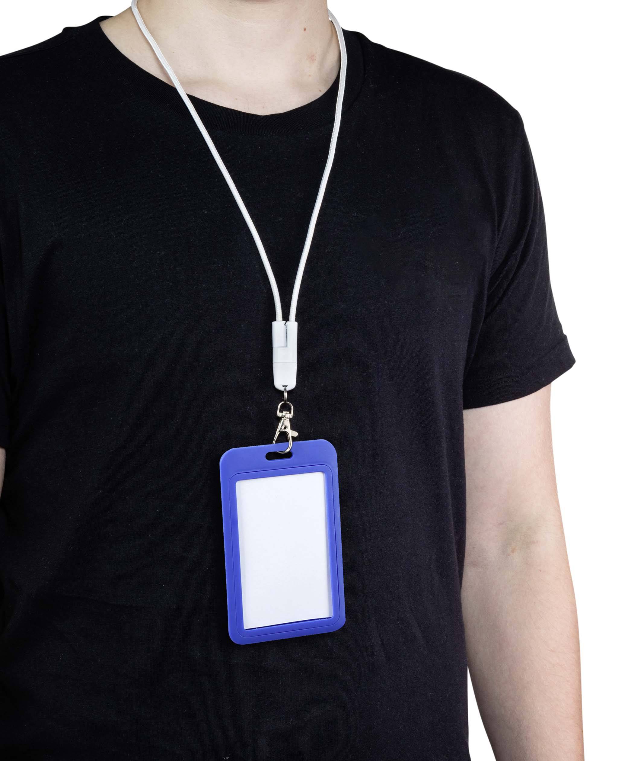 A person in a black T-shirt is wearing a blue name badge around their neck. The name badge is blank and clearly visible.