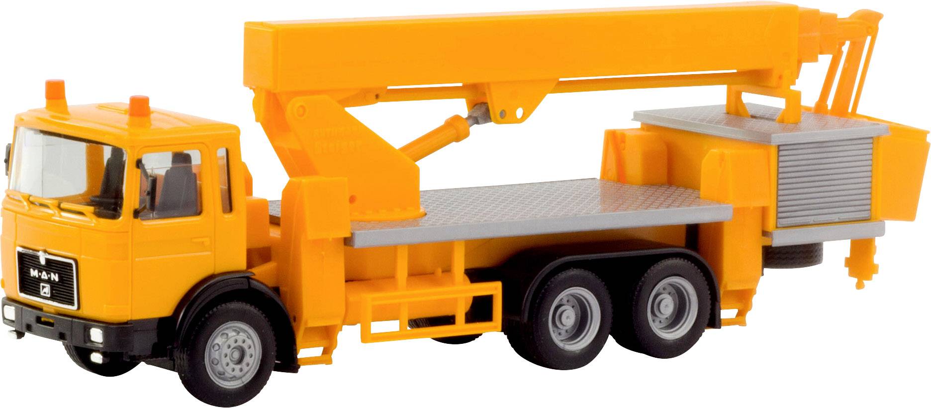 A yellow lorry with an extendable crane arm. The crane arm is stretched out over the roof of the vehicle.