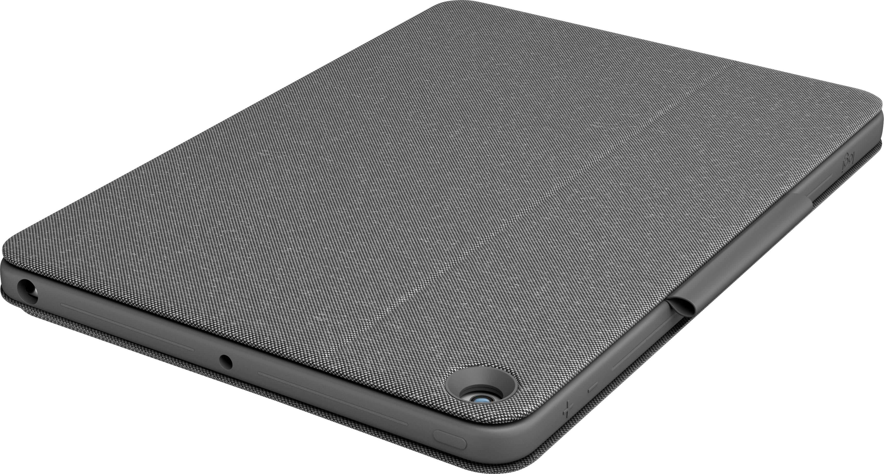 A black tablet in a protective case lies flat with the camera visible in the corner.
