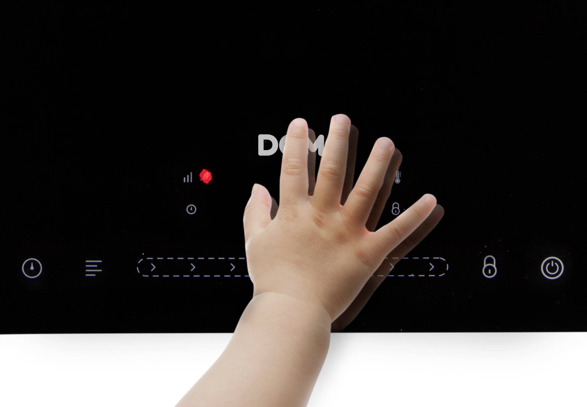 A small child's cloth touches the control buttons of a black glass-ceramic hob. Symbols and a bright light are visible.