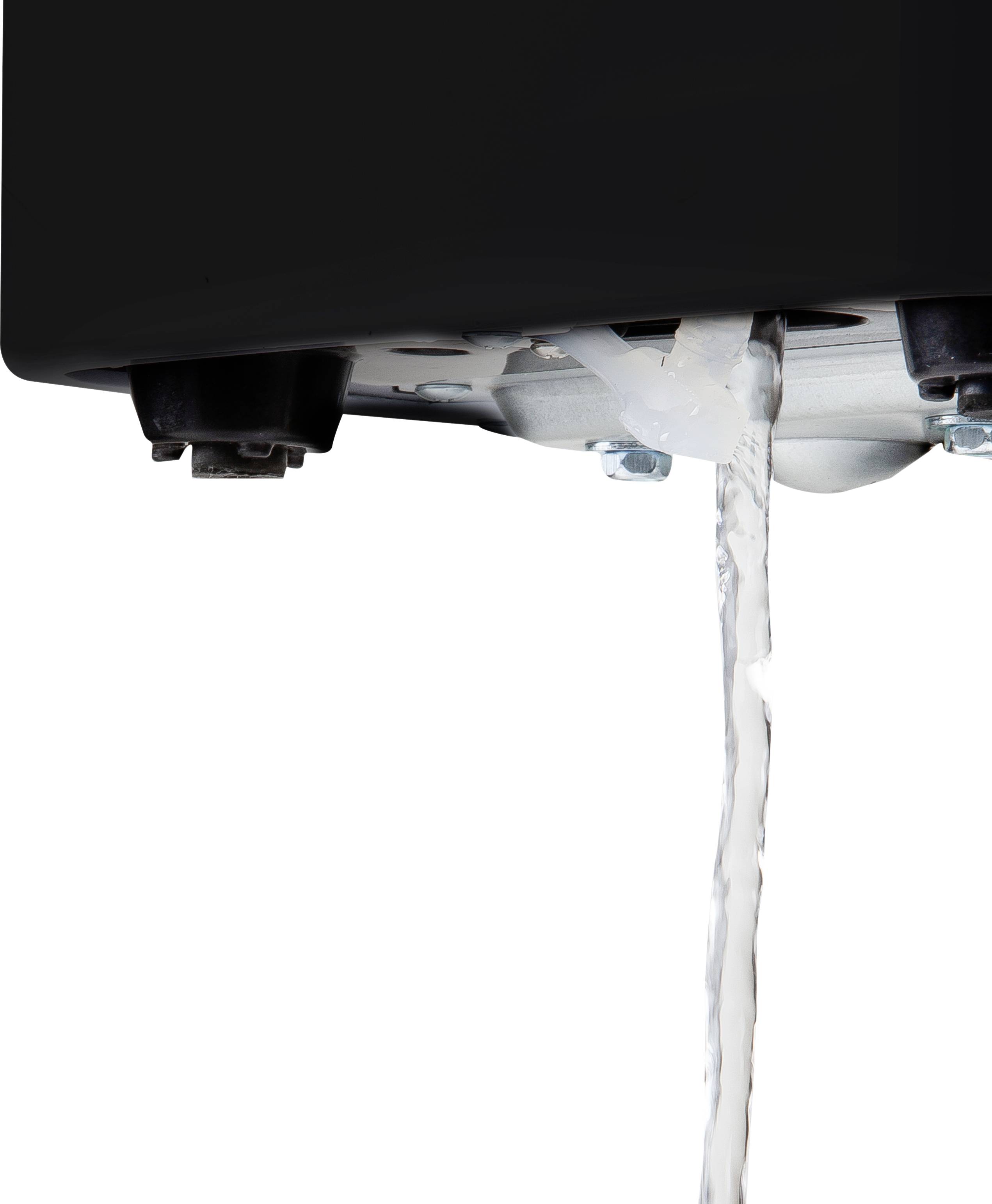 Water is leaking from a small faulty area at the bottom of the device.