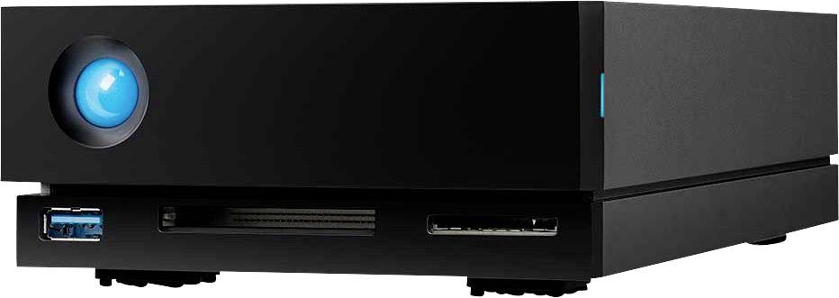 External black hard drive with a blue illuminated button on the front left, featuring multiple connection options at the front, including a USB port.