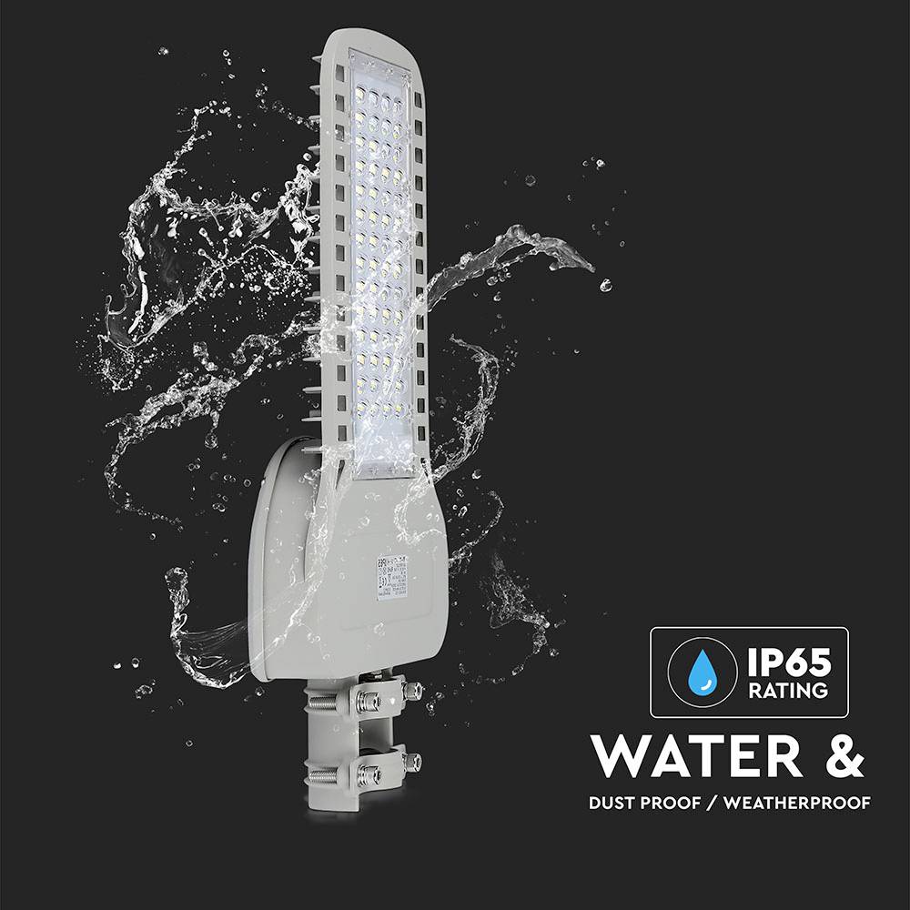 'LED street light with IP65 protection; water and dust-resistant, suitable for outdoor areas. Image with water splashes as background.'