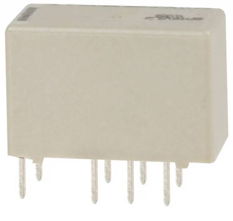 A beige rectangular electronic component with multiple metal pins at the bottom, likely a relay, used for electrical circuits.