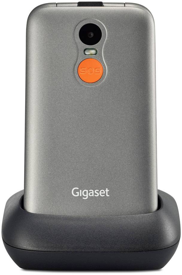 Mobile phone in a charging station. A prominent orange 'SOS' button is located beneath the camera on the back.
