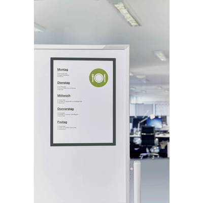 Menu board on an office wall displays the weekly menu: Monday to Friday with various dishes, next to a symbol with a knife and fork.