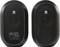 Two black, oval speakers. The left one shows controls for volume and mode. The right one is identical without controls.