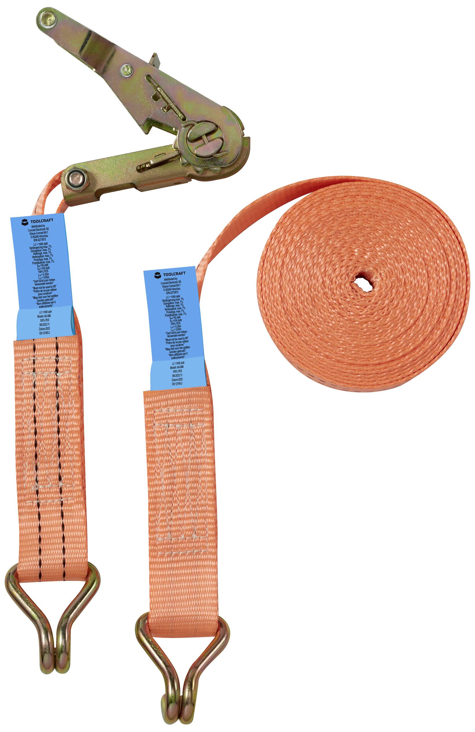 An orange lashing system with a ratchet and hooks for cargo securing. Contains labels with specifications and certifications.